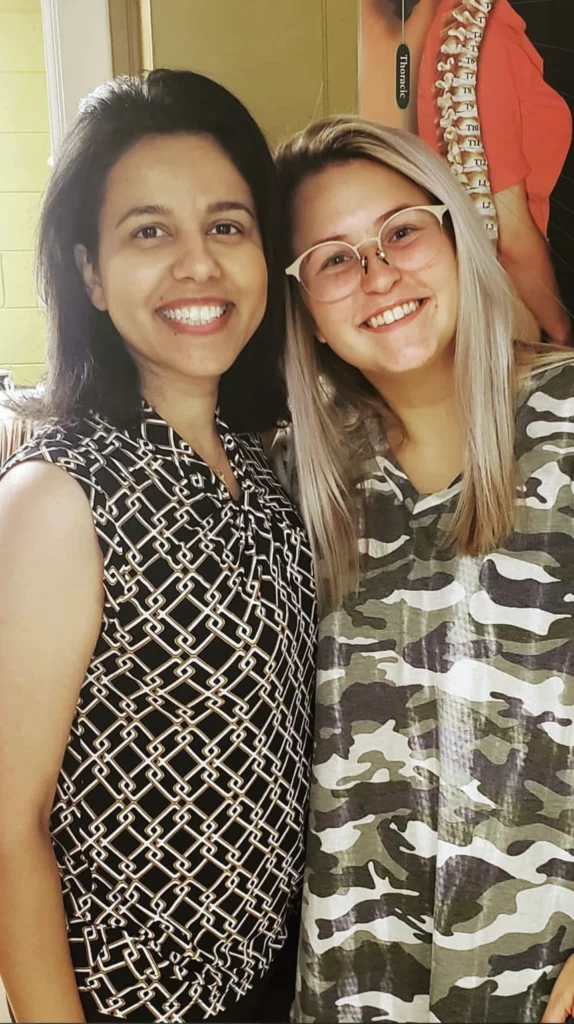 Dr Alae with young woman patient